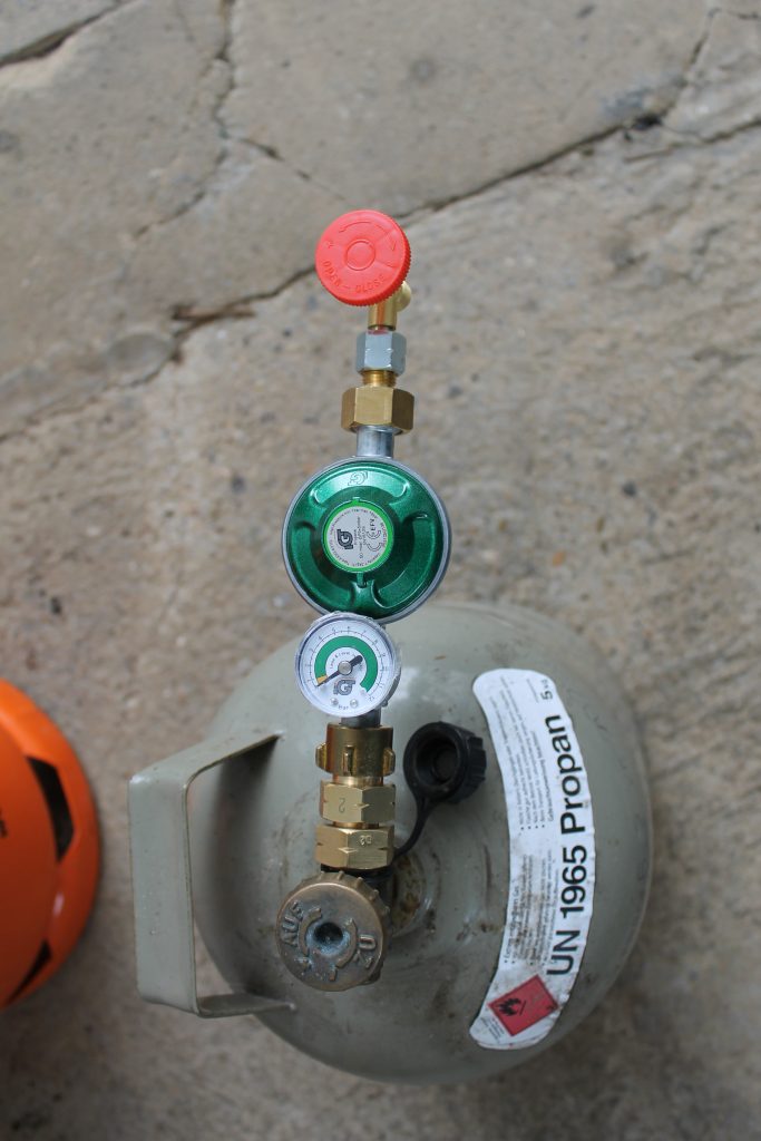 Gas pressure regulator connected to gas bottle